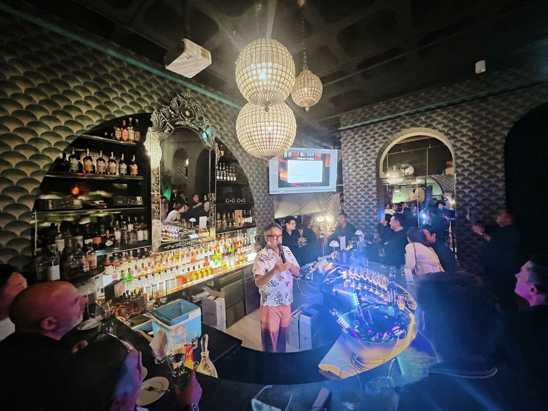 A gathering around Pacific Club’s whisky tasting bar